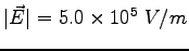 $\vert\vec E \vert = 5.0 \times 10^5~V/m$